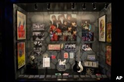 Posters for the famous UFO club from 1967, stand on display with other pieces in the Pink Floyd exhibition 'Their Mortal Remains' at the V&A museum, May 9, 2017, a journey through Pink Floyd's world of over 350 objects and artifacts.