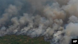 Wildfires consume an area near Porto Velho, Brazil, Aug. 23, 2019. Brazilian state experts have reported a record of nearly 77,000 wildfires so far this year, up 85% over the same period in 2018. 