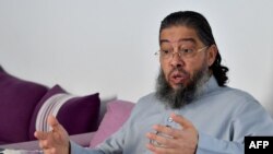 FILE —Tunisian Imam Mahjoub Mahjoubi speaks at his home in the town of Soliman on February 23, 2024, a day after being expelled from France for alleged hate speech.