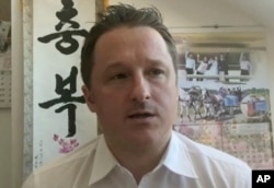 IFILE - An image made from video on March 2, 2017 shows Michael Spavor, director of Paektu Cultural Exchange, talking during a Skype interview in Yangi, China.