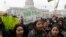 Students yell and hold up signs at a rally for clean energy in San Francisco, Feb. 28, 2018. 