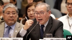 Philippine Secretary of Foreign Affairs Teodoro Locsin Jr. gestures during a senate hearing in Manila, Philippines, Feb. 6, 2020. 