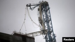 A collapsed construction crane is seen in Downtown Miami as Hurricane Irma arrives at south Florida, Sept. 10, 2017. 