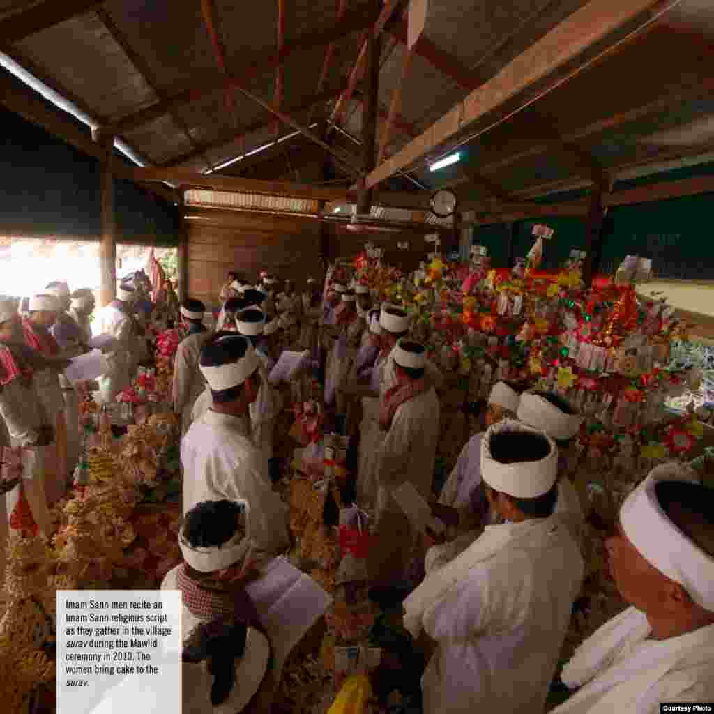 Imam Sann men recite an Imam Sann religious script as they gather in the village surav during the Mawlid ceremony, 2010. The women bring cake to the surav.(Courtesy photo of DC-Cam)