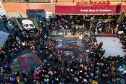 A crowd gathers at George Floyd Square after a guilty verdict was announced at the trial of former Minneapolis police Officer Derek Chauvin for the 2020 death of Floyd, April 20, 2021, in Minneapolis.