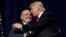 FILE - Republican presidential nominee Donald Trump embraces former New York City Mayor Rudolf Giuliani at a campaign rally in Greenville, N.C., Sept. 6, 2016.