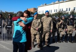 Family members and friends celebrate after a court acquitted nine leading Turkish civil society activists of terrorism-related charges including Osman Kavala, Feb. 18, 2020. Hours later, Kavala faced new charges.