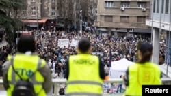 Students and other anti-government protesters block access to the offices of state broadcaster Radio Television of Serbia (RTS), keeping employees out and forcing some of its live programming to go off air, in Belgrade, Serbia, March 11, 2025.