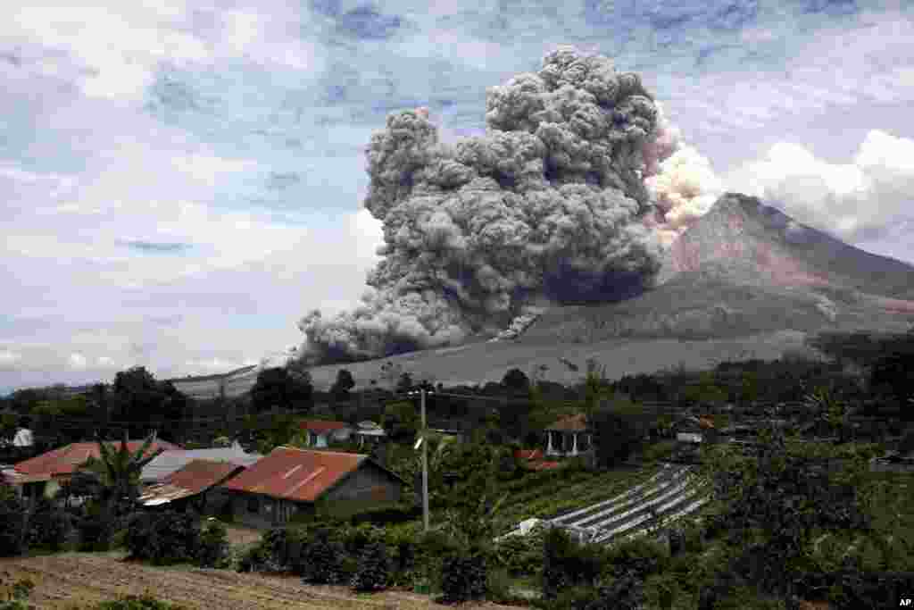 Mount Sinabung releases pyroclastic flows seen from Tiga Serangkai, North Sumatra, Indonesia. Mount Sinabung, among about 130 active volcanoes in Indonesia, has sporadically erupted since 2010 after being dormant for over 400 years.