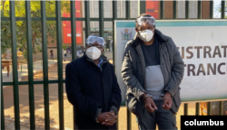 Transform Zimbabwe’s Jacob Ngarivhume and reporter Hopewell Chin’ono outside Harare Magistrates Court on July 22, 2020 in Harare. (Photo: Columbus Mavhunga/VOA)