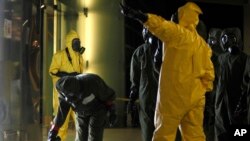 A hazardous materials crew examines an area at Kuala Lumpur International Airport in Sepang, Malaysia, Feb. 26, 2017. Malaysian officials say Kim Jong Nam was poisoned with nerve agent.