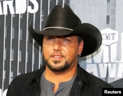 FILE - Country music singer Jason Aldean poses at the 2017 CMT Music Awards in Nashville, Tennessee, June 7, 2017.