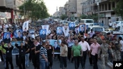 Muslims and Christians chant anti-terrorist slogans during a funeral of slain Christians in Baghdad, Iraq, 02 Nov 2010