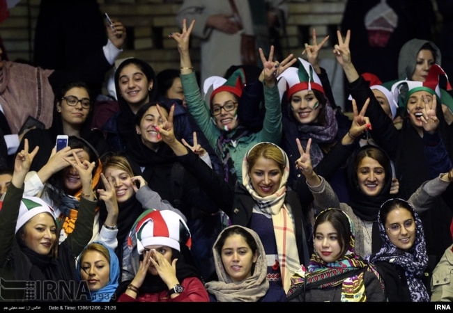 Iranian women watch the Iranian men's basketball team play Iraq in a FIBA World Cup Asian Qualifier at Azadi Indoor Stadium in Tehran, Feb. 25, 2018.