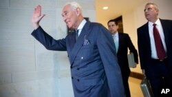 Longtime Donald Trump associate Roger Stone arrives to testify as part of the House Intelligence Committee's investigation into Russian meddling in the 2016 election, in Washington, Sept. 26, 2017. 