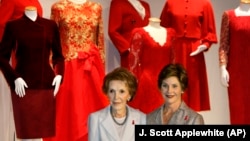 "Happy Heart Syndrome" affects mostly women. Little is known about the disease. Pictured here are First Ladies Nancy Regan and Laura Bush in 2005. They raised awareness about women and heart disease with a national campaign featuring red dresses worn by First Ladies throughout history. (AP Photo/J. Scott Applewhite) 