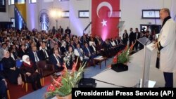 Turkey's President Recep Tayyip Erdogan speaks after receiving a honoris doctorate from the International University of Sarajevo, in Sarajevo, Bosnia, May 20, 2018. Turkey's president addressed thousands of expatriate Turks in Bosnia's capital Sunday to shore up support before his country's snap presidential and parliamentary elections next month.