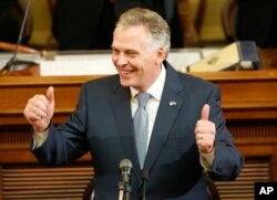 FILE - Virginia Gov. Terry McAuliffe delivers his State of the Commonwealth Address at the Capitol in Richmond, Virginia, Jan. 13, 2016.