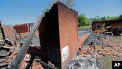 The burnt ruins of the St. Mary Baptist Church, one of three that recently burned down in St. Landry Parish, are seen in Port Barre, La., Apr. 10, 2019.