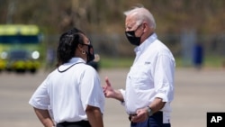 President Joe Biden talks with New Orleans Mayor LaToya Cantrell as he arrives at Louis Armstrong New Orleans International Airport in Kenner, La., Sept. 3, 2021, to tour damage caused by Hurricane Ida.