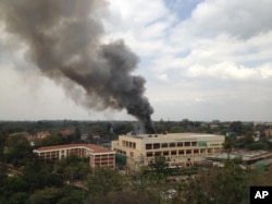 FILE - Heavy smoke rises from the Westgate Mall in Nairobi, Kenya, after multiple large blasts rocked the facility during an assault by security forces, Sept. 23, 2013, in response to a terrorist attack.