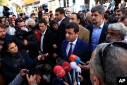 The HDP’s Selahattin Demirtas visits Istanbul headquarters of the Koza-Ipek Holding media company, which police seized in a dawn raid on Oct. 28, 2015. The company is linked to opposition television stations and to Fethullah Gulen, a U.S.-based moderate I