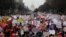 FILE - Thousands of people participate in the Third Annual Women's March at Freedom Plaza in Washington, Jan. 19, 2019. 