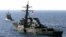 FILE - The U.S. Navy destroyer USS Cole is towed away from the port city of Aden, Yemen, into open sea, Oct. 29, 2000. 
