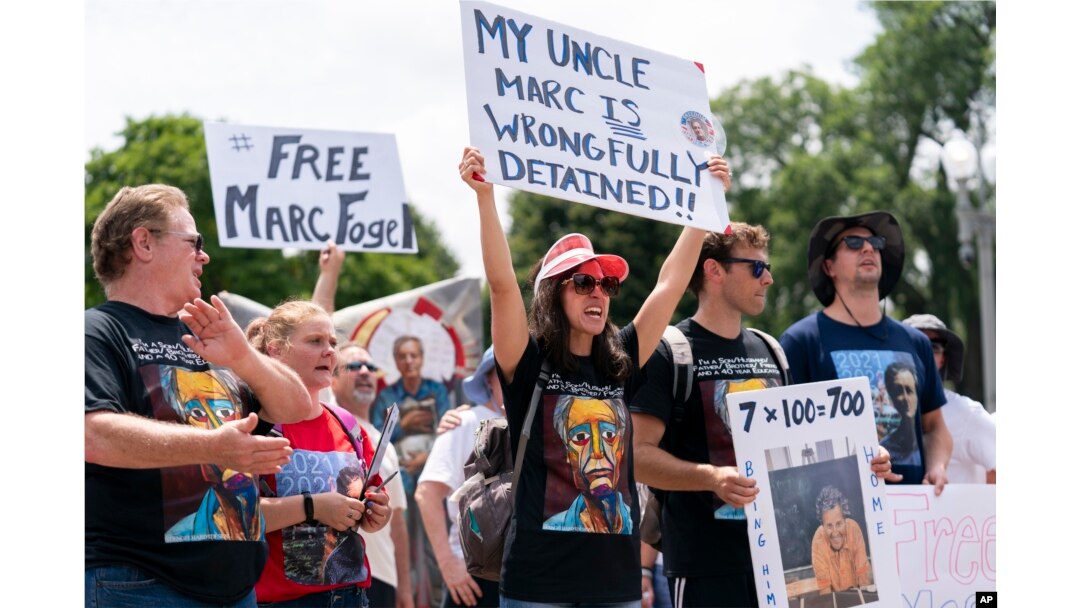 FILE - Ellen Keelan, center, and other family members rally outside the White House for the release of Marc Fogel, who had been detained in Russia, July 15, 2023, in Washington.