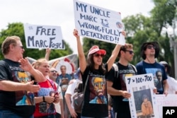 FILE - Ellen Keelan, center, and other family members rally outside the White House for the release of Marc Fogel, who had been detained in Russia, July 15, 2023, in Washington.