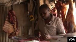 After learning how quickly meat spoils without refrigeration, butcher James Kuria buys less and keeps it for less time. (Credit: S. Baragona/VOA)