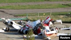 FILE - The wreckage of the Polish Tupolev Tu-154M presidential aircraft that killed Polish president Lech Kaczynski and 95 others is seen at the airport in Smolensk, Oct. 1, 2010.