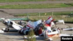 FILE - The wreckage of the Polish Tupolev Tu-154M presidential aircraft that killed Polish president Lech Kaczynski and 95 others is seen at the airport in Smolensk, Oct. 1, 2010.