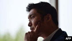 Thanathorn Jungroongruangkit, founder of the now-dissolved Future Forward Party, listens during an interview in Bangkok on Jan. 21, 2021, after being accused of contravening Thailand's strict royal defamation lese majeste laws. 