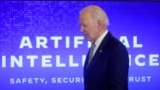 FILE - President Joe Biden walks across the stage to sign an executive order about artificial intelligence at the White House, Oct. 30, 2023. On Jan. 14, 2025, Biden signed another executive order to boos development of AI infrastructure.