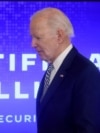 FILE - President Joe Biden walks across the stage to sign an executive order about artificial intelligence at the White House, Oct. 30, 2023. On Jan. 14, 2025, Biden signed another executive order to boos development of AI infrastructure.