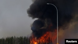 A wildfire burns near Highway 63 south of Fort McMurray, Alberta, Canada, May 6, 2016. 