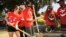 Mexican actress/singer Dulce Maria, far left, helps to build a children's playground at City of Lynwood Park, Aug. 29, 2012, in Lynwood, California.