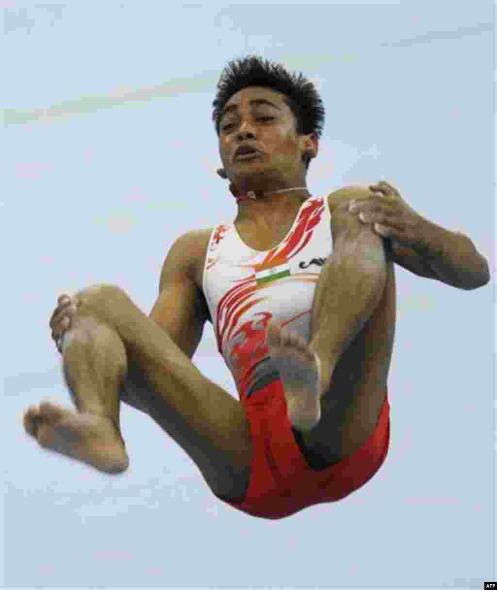 India's Ashish Kumar performs in the men's floor exercise at the gymnastics at the 16th Asian Games in Guangzhou, China, Tuesday, Nov. 16, 2010. (AP Photo/Ng Han Guan)