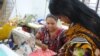 Women work in a tiny garment workshop opened and staffed by survivors of the collapse of Rana Plaza in Dhaka. (Amy Yee for VOA News)