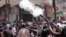 An image made from video shows police firing tear gas at supporters of ousted President Mohammed Morsi in Alexandria, Egypt, Aug. 14, 2013.