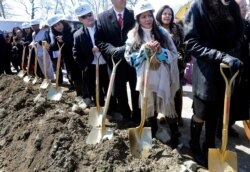FILE - In this April 5, 2016 file photo, Mashpee Wampanoag Tribal Council member Winnie Johnson Graham, foreground, participates in the groundbreaking for a new casino resort in Taunton, Mass.