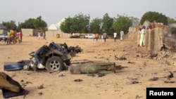 FILE - Damage is seen following an attack by Boko Haram militants in the northeast city of Maiduguri, Nigeria, April 27, 2018. 