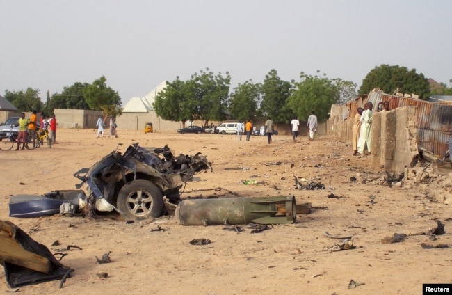 FILE - Damage is seen following an attack by Boko Haram militants in the northeast city of Maiduguri, Nigeria, April 27, 2018.