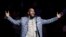 FILE - Musical artist R. Kelly performs the national anthem before an NBA basketball game between the Brooklyn Nets and the Atlanta Hawks in New York.