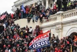 Supporters of U.S. President Donald Trump gather at the west entrance of the Capitol during a "Stop the Steal" protest outside of the Capitol building in Washington D.C. U.S. January 6, 2021.