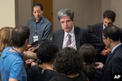 French Ambassador Francois Delattre speaks to reporters as he arrives for a Security Council meeting, July 24, 2017, at U.N. headquarters.