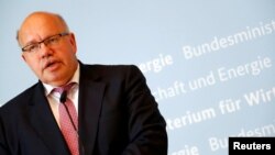 FILE - German Economic Affairs and Energy Federal Minister Peter Altmaier addresses the media in Berlin, July 17, 2018.
