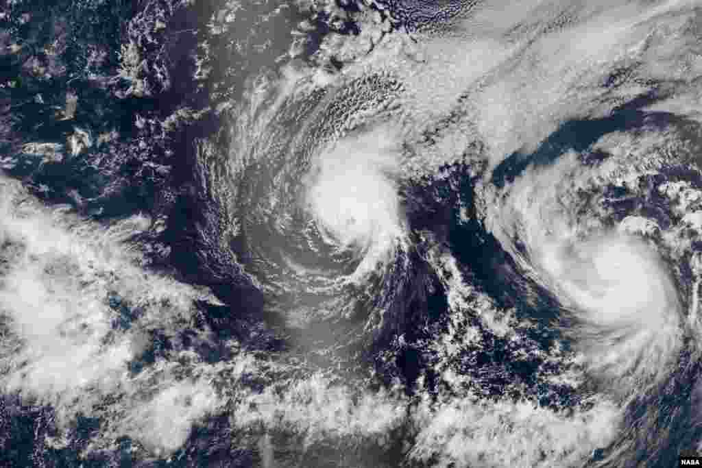 The Visible Infrared Imaging Radiometer Suite (VIIRS) sensor on the Suomi National Polar-orbiting Partnership (NPP) satellite captures natural-color images of two hurricanes Iselle and Julio en route to Hawaii.