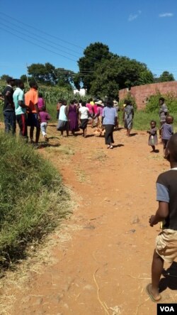 Some people seen at the Arcturus Mine compound where women are protesting over outstanding salaries for their husbands. (Courtesy Image)